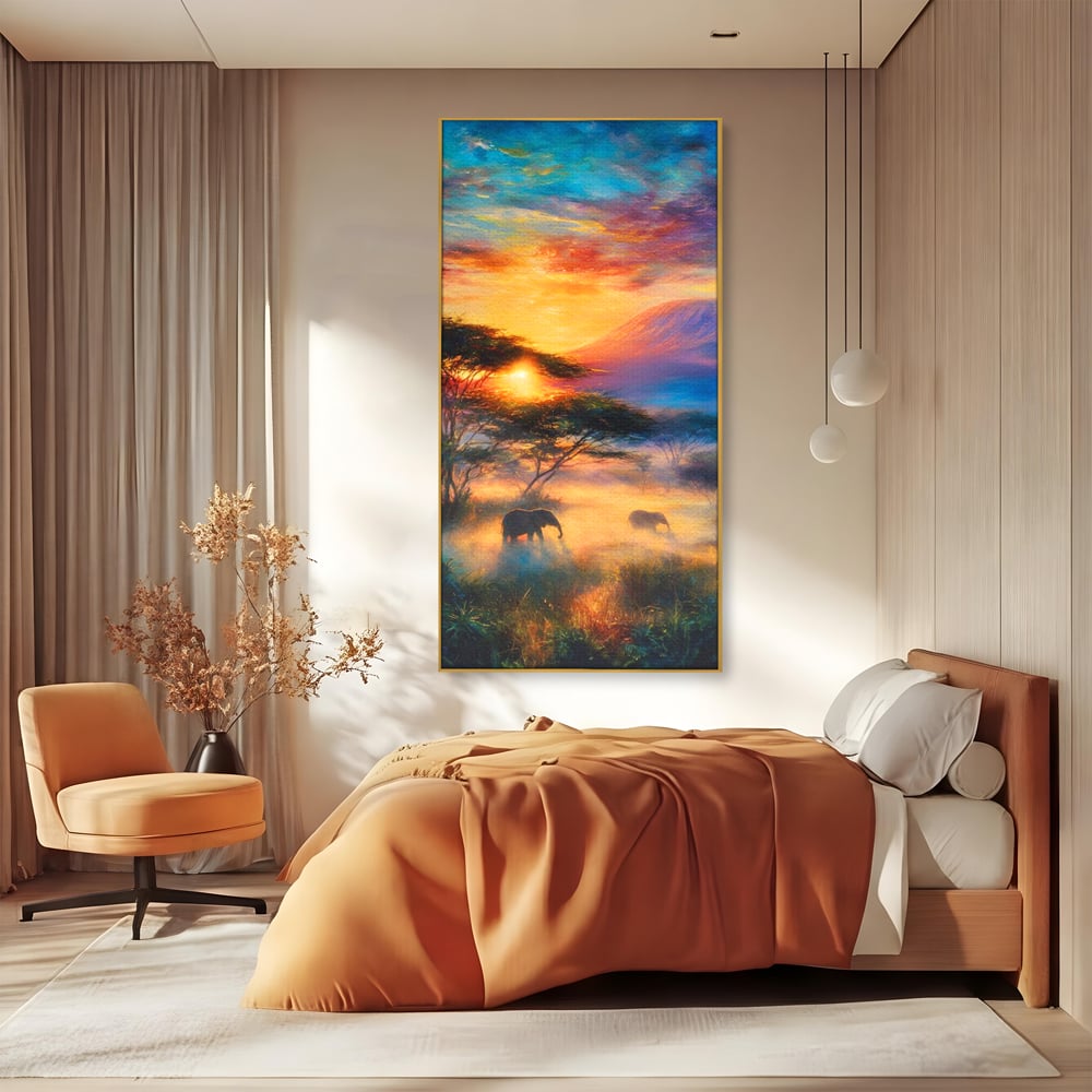 Tablou canvas cu tablou canvas cu elefanti la apus, in rama de aluminiu auriu, pe perete intr-un dormitor